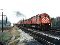 Westbound leader, M-636 #4711, received Caterpillar engine back in the late '80s; the only unit to be converted. All locomotives in this particular series retired by 1995. The M-424s lasted a couple of years longer. Impressive pulling power in this image: CP 4711, 4244, 4731, 4246 and 4570. Nice treat for a rather cruddy late afternoon.