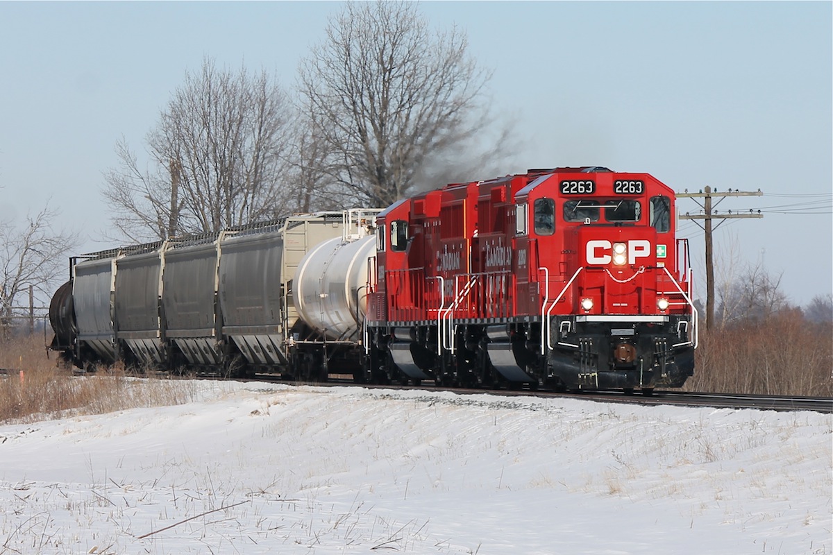 These candy apple red GP20C-ECO's (ex GP9u's) show off their brand new shape as they lead T29 back to Windsor after working Kent Bridge - Mile 48 on the Windsor Sub.