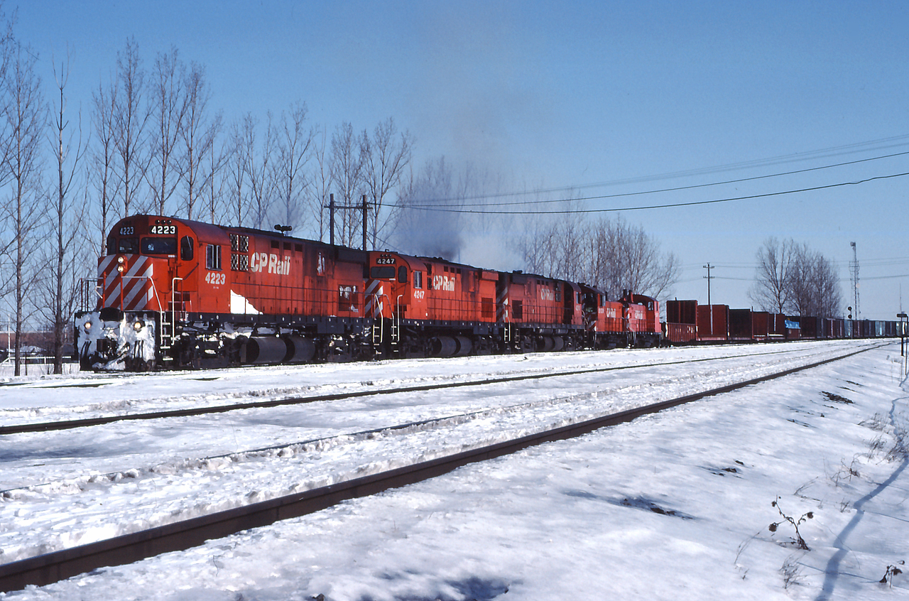A trio of C424s and a pair of SW1200RS' depart Toronto Yard for points west, on a crisp February day.