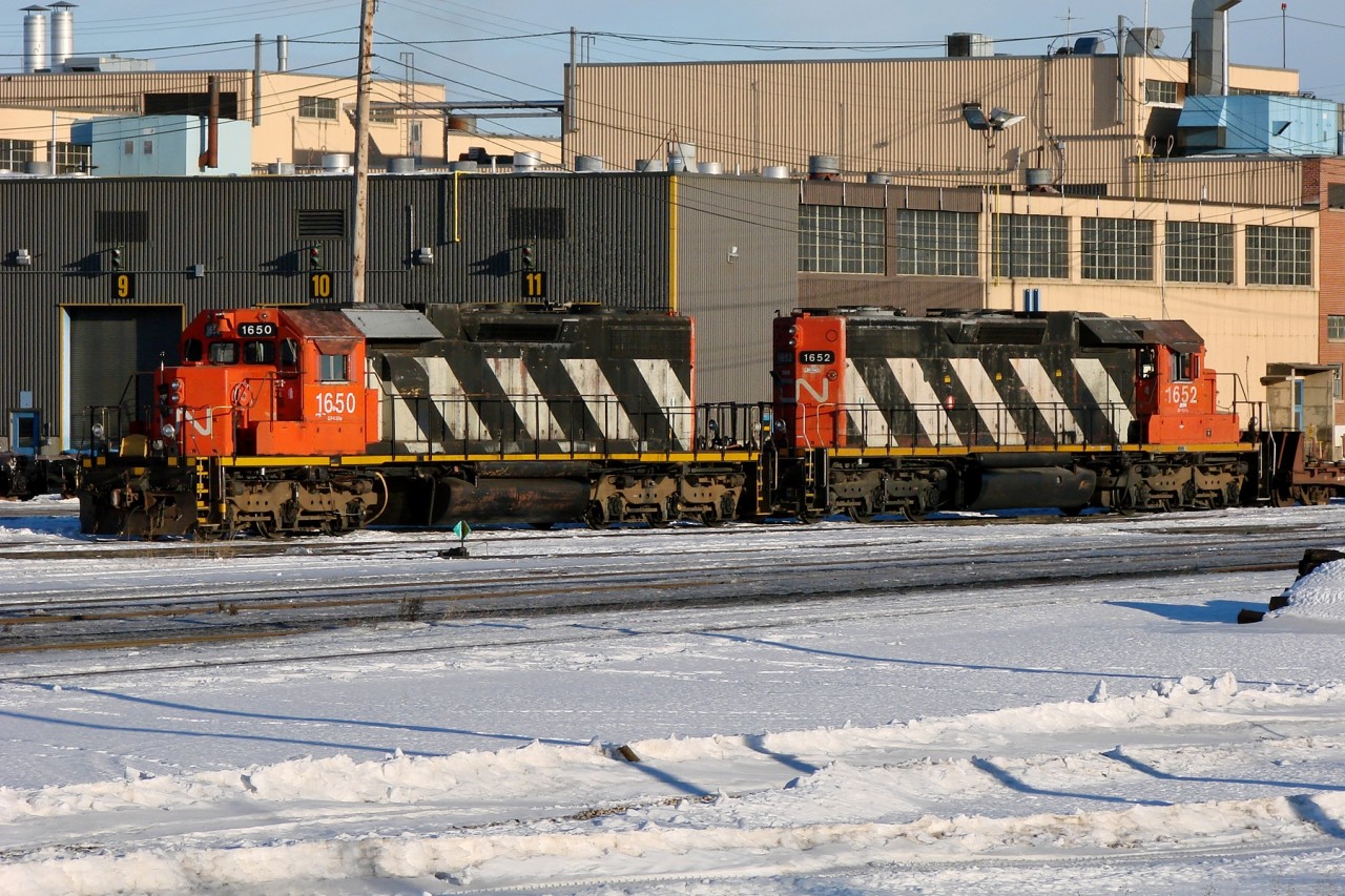 Former Northern Alberta Railway SD38-2s 1650 and 1652 parked at Walker Yard.