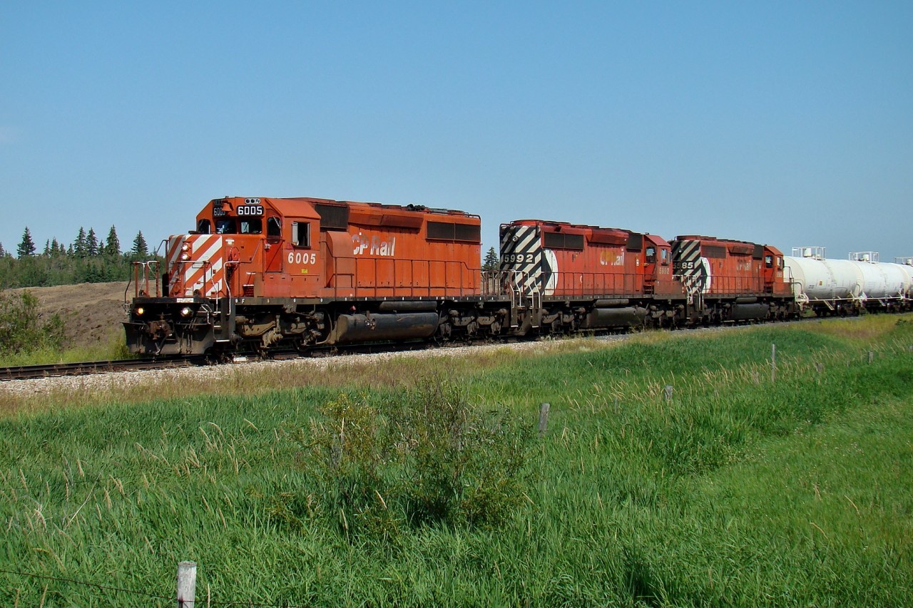 SD 40-2s 6005, 5992, and 5585 bring the Scotford turn into Scotford yard.