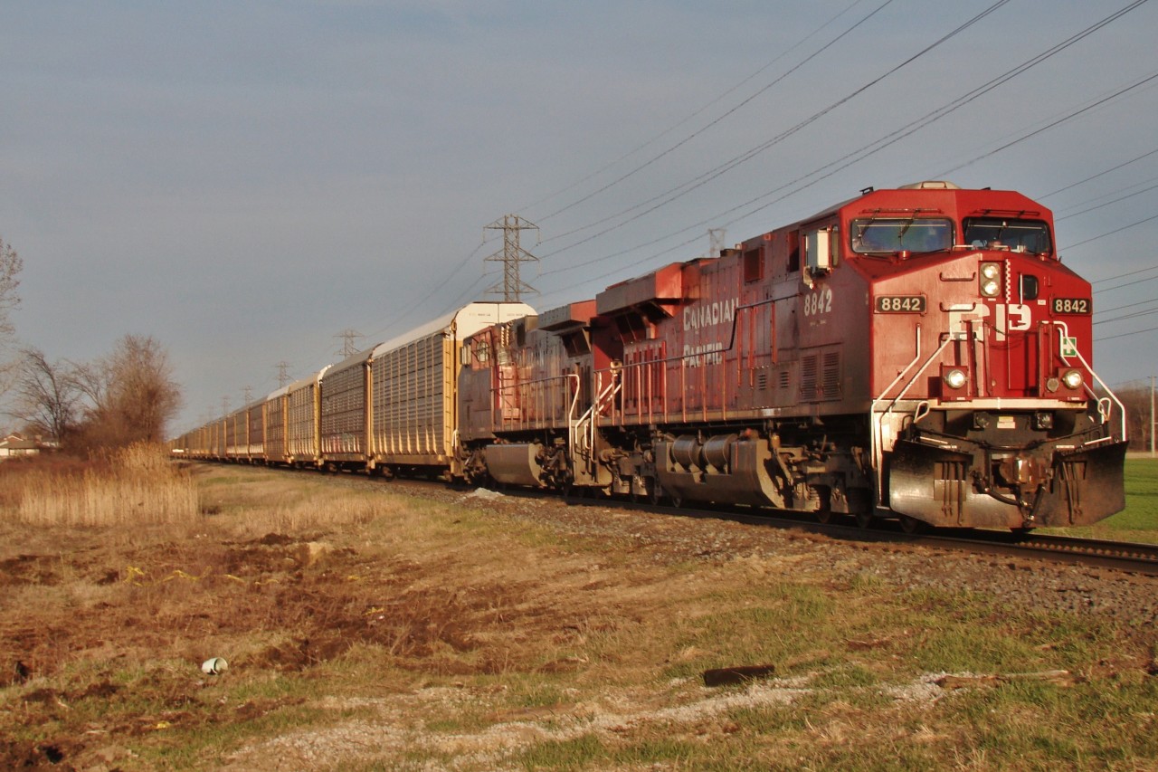 CP 8842 leads a westbound into the setting sun flying past Banwell Rd.