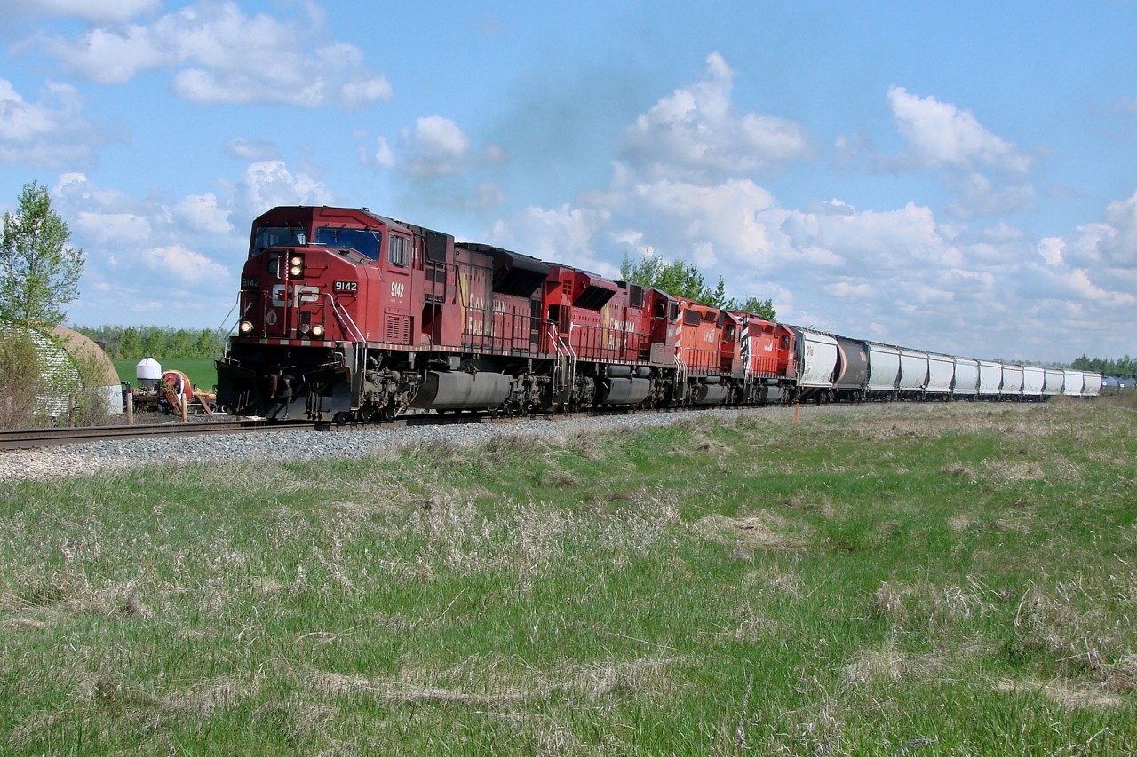 SD9043MAC 9142, SD9043MAC 9140, SD40-2 5913 and SD40-2 6067 travel south on the Red Deer subdivision.