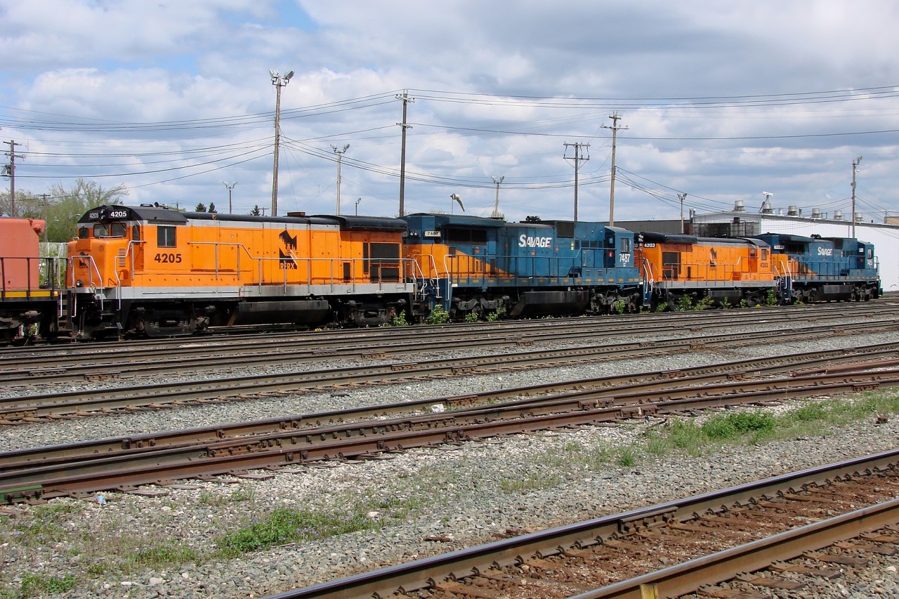 Stored locomotive from the Savage Alberta Railway/Alberta RailNet including RFRX B23-7 4205, SAR C39-8 7487, RFRX B23-7 4203, and SAR C39-8 7485 parked at Walker Yard.