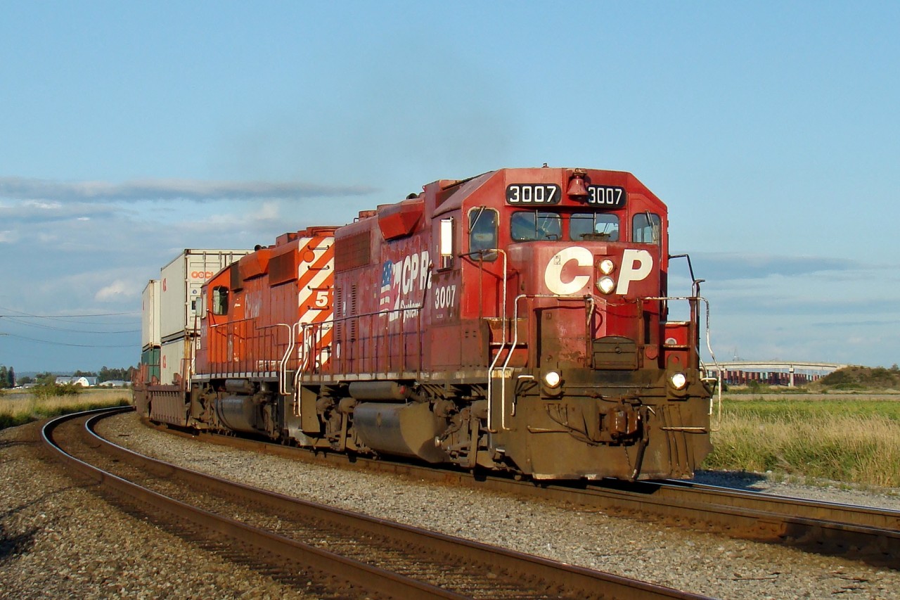 GP38AC 3007 and SD40-2 5796 lead an intermodal transfer into the Port of Vancouver's Deltaport.