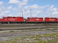 GP38-2's 3062 and 3035 with GP35 Control Cab 1125 parked at Alyth Yard.