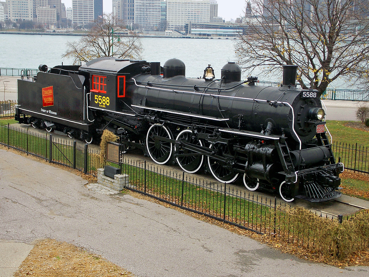 Canadian National Railway 4-6-2 Pacific-type steam locomotive on display at Riverside Park in Windsor, ON, Detroit River & skyline in background. Built in 1911 by CN's Point St. Charles Shops, with 73 inch drivers & 33,630 pounds of tractive effort.  For more pics & videos from my collection see my website at  http://northamericabyrail.info  (New trips added)