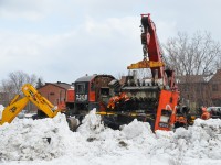 <b><i>Scrapping on-site.</i></b> CN 7208 was involved in a sideswipe and a derailment very early Sunday morning in the St-Henri neighbourhood of Montreal. Its frame was bent and so is being scrapped on site. For more train photos, click <a href=http://www.flickr.com/photos/mtlwestrailfan/>here.</a>

