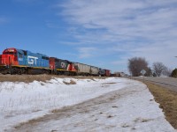 GTW 4927 & CN 4700 lead CN 439 westbound past the Tecumseh Line crossing at Jeannettes Creek on their way back to Windsor.