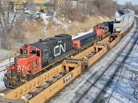 A GP9/slug/GP9 trio (CN 7250, CN 218 & CN 7019) are stopped as CN 120 passes on the right. This train was hauling damaged cars from a derailment that occurred a few miles east of here overnight involving a sideswipe between CN 121 and a local switcher. For more train photos, click <a href=http://www.flickr.com/photos/mtlwestrailfan/>here.</a>