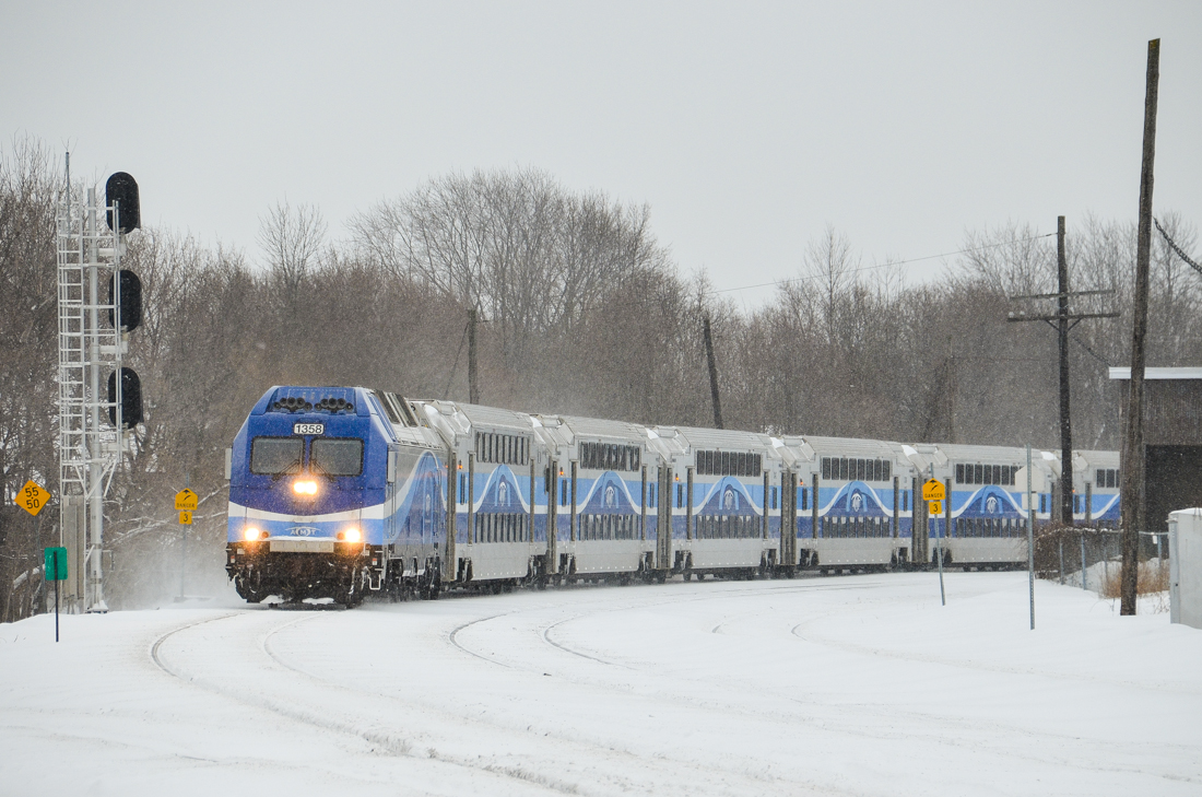 AMT 1358 leads a deadhead movement around a curve in Montreal West, just west of Westminster Avenue. For more train photos, click here.