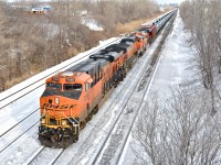 An empty oil train (CN 711) heads west with three BNSF GE's (7056, 4349 & 7284). This is the first time I catch a solid BNSF lashup on an oil train. For more train photos, click <a href=http://www.flickr.com/photos/mtlwestrailfan/>here.</a>