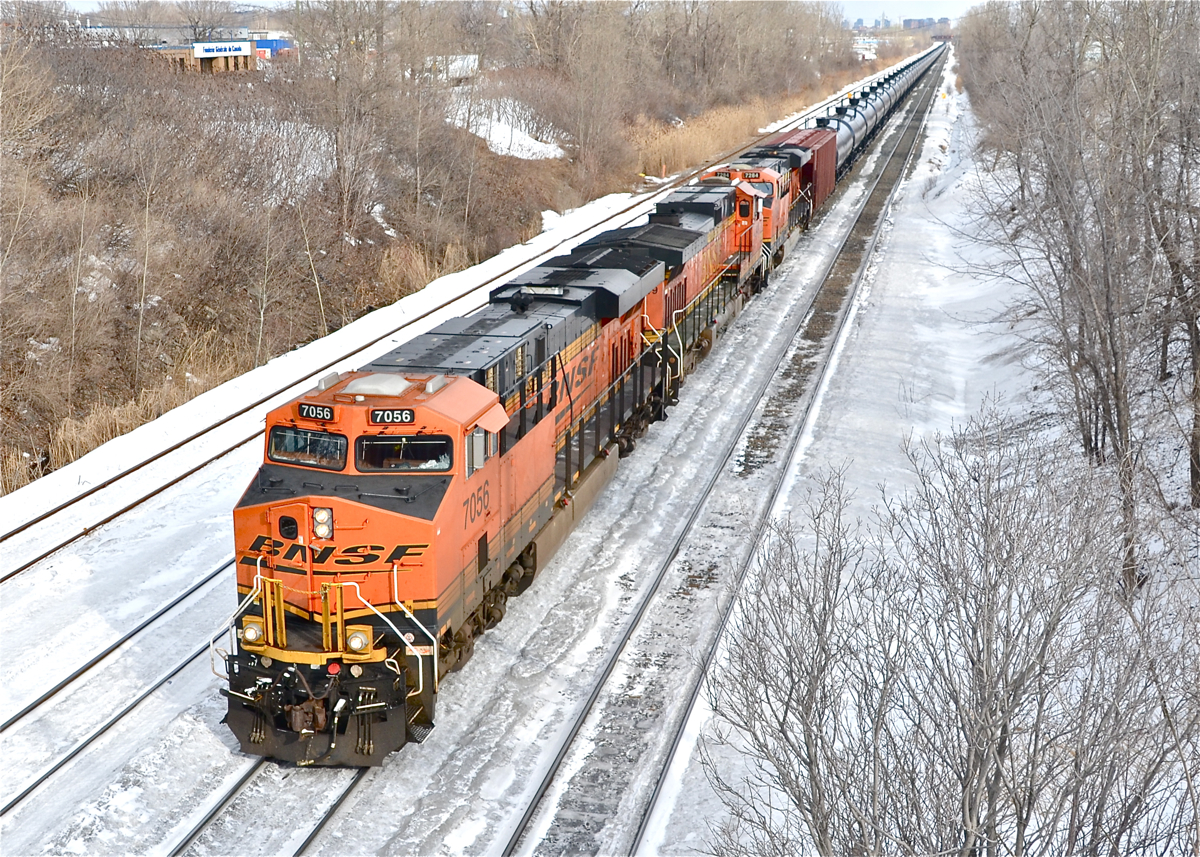 An empty oil train (CN 711) heads west with three BNSF GE's (7056, 4349 & 7284). This is the first time I catch a solid BNSF lashup on an oil train. For more train photos, click here.