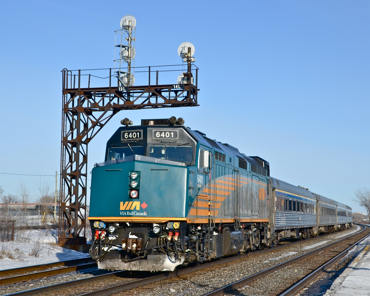 VIA 6401 is a few seconds away from making a station stop with outbound VIA 67 at Dorval. Most VIA trains in either direction operate on the track closest to me, but there was an inbound train due, allowing me to catch this train on the north track. For more train photos, click here.