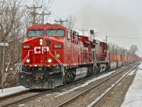CP 9825 & CP 8556 rocket west through Beaconsfield with a westbound stack train. The train is passing 2 brand new set of signals which are not yet in use and which were not there when I was here 2 months ago. They will help convert the Vaudreuil Sub to 100% CTC by the end of 2014. For more train photos, click <a href=http://www.flickr.com/photos/mtlwestrailfan/>here.</a>