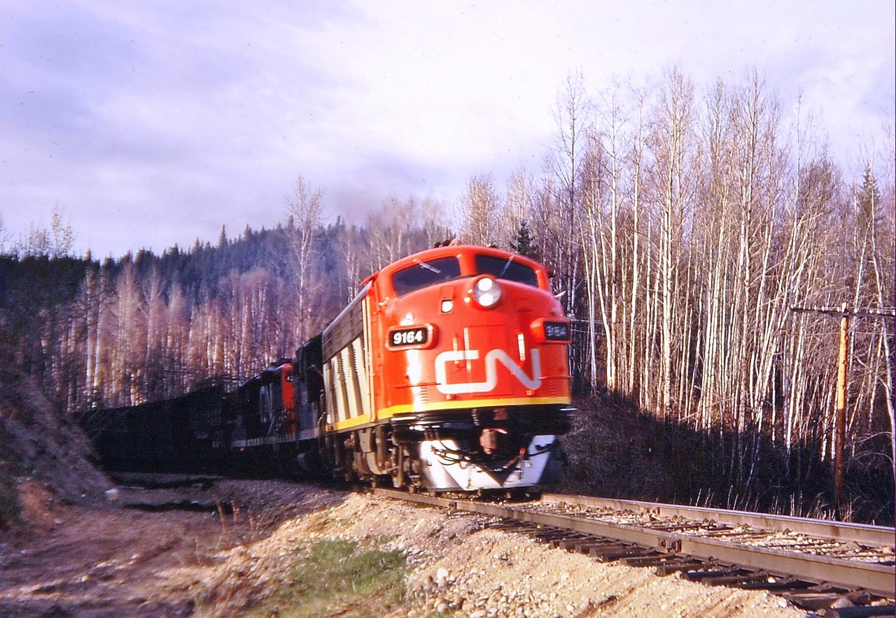 CN 9164(F7Au) is at the head of this eastbound freight out of Prince George as it approaches Crescent Spur on the Fraser sub.
