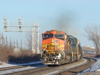 As is becoming commonplace, foreign power that came into Montreal on CN 720 (loaded oil train) is seen leaving on CN 377. Lashup was BNSF 4350, CSXT 7743 & BNSF 8851. This train was delayed at Taschereau Yard for a few hours and so was really moving. For more train photos, click <a href=http://www.flickr.com/photos/mtlwestrailfan/>here.</a>
