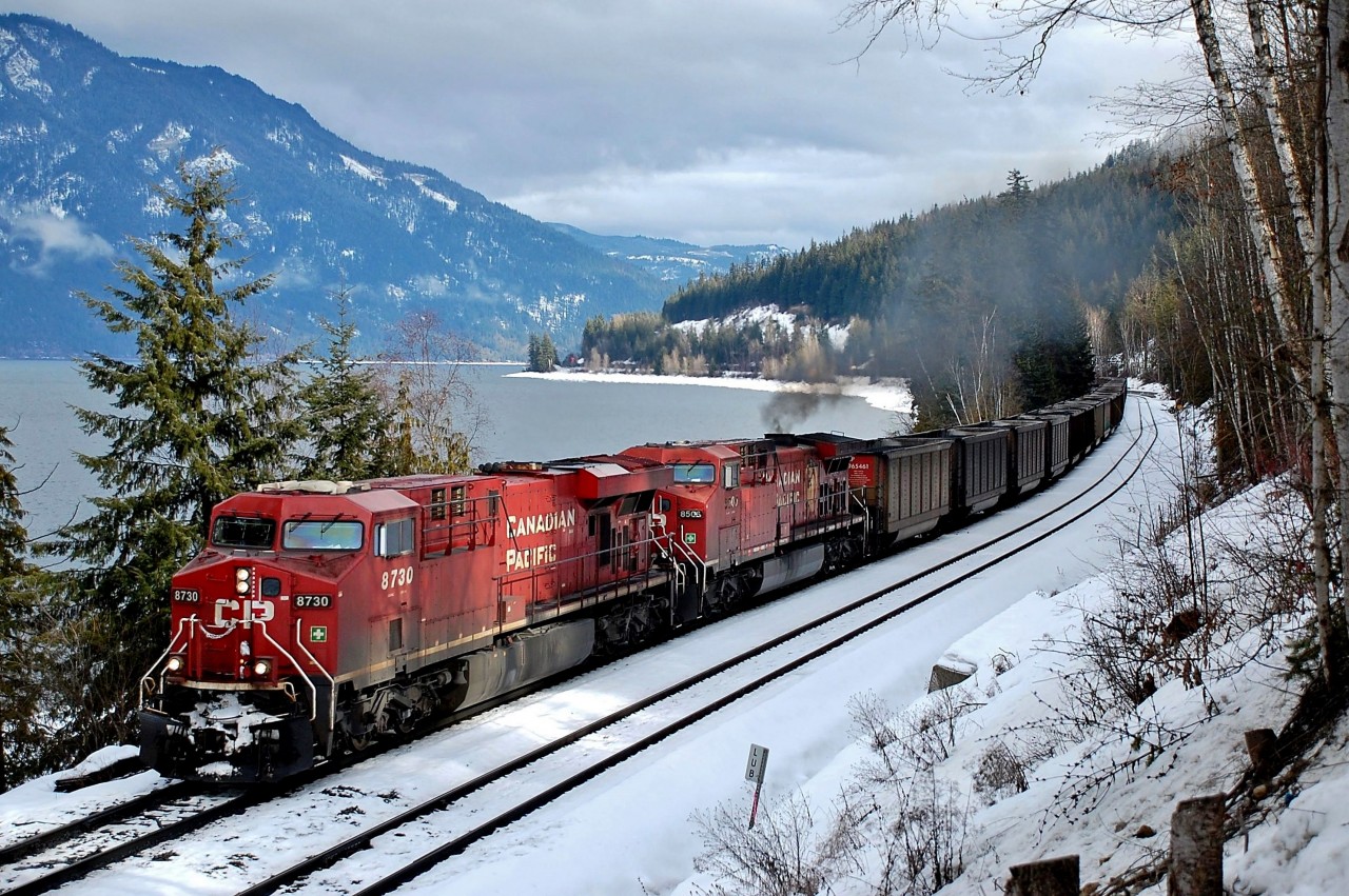 CP 8506 is generating some smoke as it helps CP 8730 speed this westbound coal train along the north track just east of Canoe.