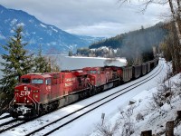 CP 8506 is generating some smoke as it helps CP 8730 speed this westbound coal train along the north track just east of Canoe.