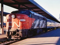 MLW FPA-4 CN 6774 is preparing to leave Ottawa with a three coach passenger train for Montreal. Taken in the spring of 1978.