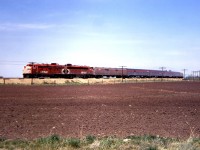 The "Canadian" is westbound near Brooks, Alberta in the spring of 1973.