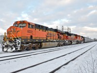<i><b>Triple Swoosh.</b></i> With 3 BNSF engines in the 'swoosh' paint scheme (BNSF 6031, BNSF 9255 & BNSF 9243) that came in early in the morning on CN 720 (loaded oil train), CN 377 slowly begins heading west through Dorval. I'm dedicating this photo to my wife (Tamara Fisher) for waiting 3 hours at the nearby VIA Dorval station while I waited for this slightly later than usual train.... We were on our way to Ottawa! For more train photos, click <a href=http://www.flickr.com/photos/mtlwestrailfan