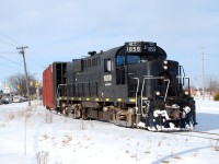 Trillium Railway 1859 pulls four loads out of EnergeX Tube on Ontario Street. They're on their way to WR yard to exchange the loads for empties that they will shove back in to the plant.