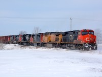 CN2594 leads UP6434, CN2449, NS8432, CN 2511 and CN2648 east bound at Camlachie Road near Wyoming, Ontario.