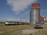 Great Western sets out an empty grain hopper at the elevator in Cadillac SK. 