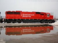 CP 246 had to stop at Fort Erie and wait for clearance from the CSX dispatcher to cross the International Bridge.  Their power was CP 6223 and CEFX 1048, where they stopped allowed for me to capture this shot of an almost perfect mirror image of the rebuilt SD60 in a freshly made puddle from the mild temperatures that day.