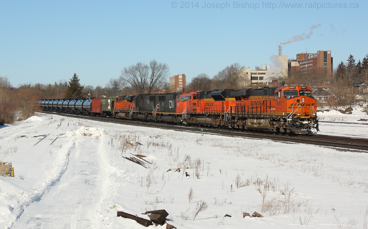 CN U710 comes down grade through Brantford with BNSF 6907, BNSF 9201, CN 5625, IC 1027, BNSF 7483.  This was the first of two unit crude oil trains today on the Dundas Sub.