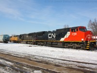 CN 396 is sitting in the Brantford yard waiting for their clear signal back onto the North track after completing their drop.  Their colourful consist was CN 2168, IC 1026, UP 4651.