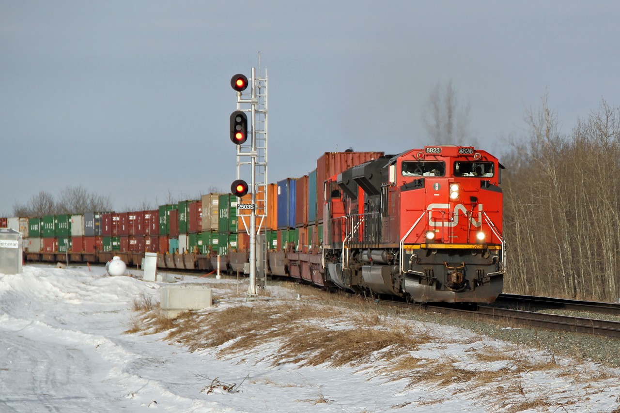 A pair of SD70M-2's, CN 8823 and 8813, take the second main line at Ardrossan with an eastbound intermodal.
