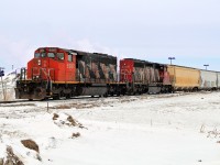 SD40-2(W)'s CN 5287 and 5246 take Dow hopper cars along the Fort Saskatchewan Industrial lead from Scotford Yard.