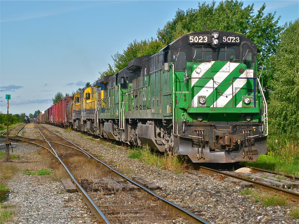 MMA 2 is sitting just west of Farnham awaiting a fresh crew, with four GE C30-7's at the head end (MMA 5023, MMA 5017, MMA 3609 & MMA 3000). For a shot of this same train crossing the Eastman trestle later in the day, click here. For more train photos, click here.