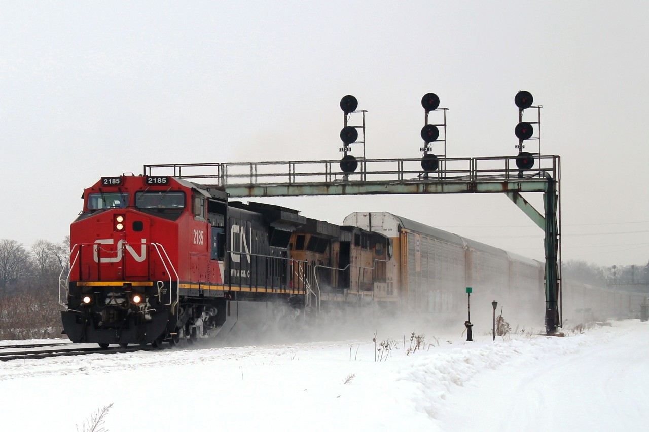 10:30, CN 2185 and UP7045 drive through the flurries under the signal gantry at Paris with a consist of mainly Autoracks. As mentioned about the UP on Wednesday this too had its long hood hatch door open.