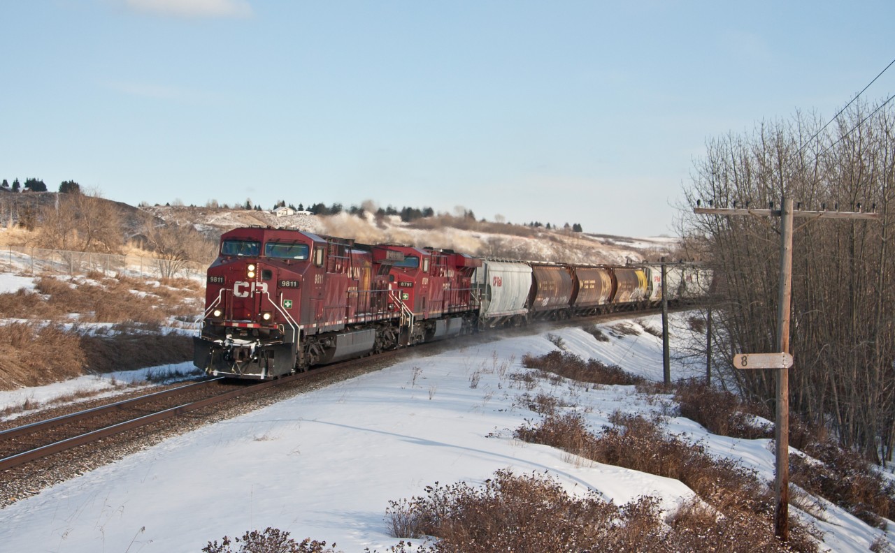 Approaching Keith yard, but not stopping, this grain train is on it's way out of Calgary.