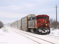 CN 2414 solo is doing track speed past Heritage Road just east of Georgetown, where it met CN X301. A winter wonderland after yesterdays all day snow fall.