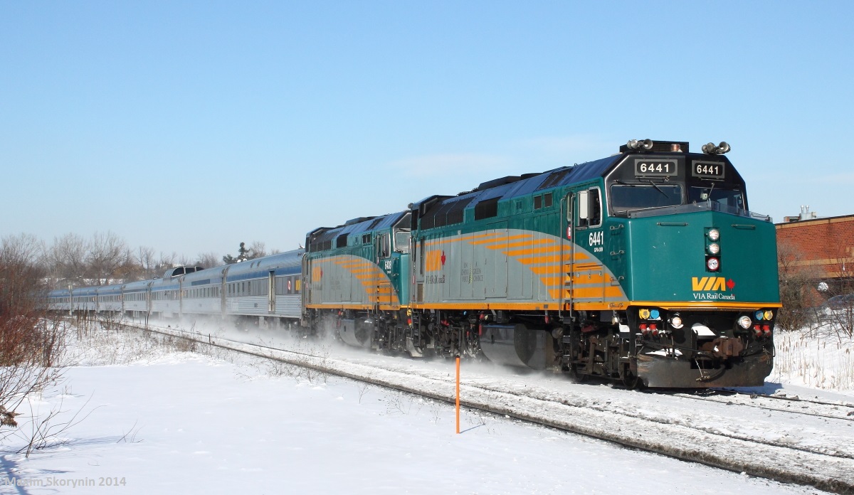 On a nice sunny day without a single cloud, knowing that VIA trans-continental train "The Canadian" is just about 2 hours late which will be a good shot in the morning day light, I decide to head out and give a new spot a try, at Green Lane in Markham, ON just a few hundred metres north of Doncaster junction. VIA #2 is scheduled to arrive at Toronto Union station at 0915, but due to lateness, is arriving into Toronto Union at just about 1240. Ahead of VIA #2, CN 302 rolls by on the West track (Closer track) with a decent lashup, and then junctions onto the York subdivision at Doncaster junction. Just as its tail end passes, VIA #2 rolls by creating my second train race. A person also almost got hit by #2, who decided to run across the tracks before the gates went up just after 302 passed. Please be careful out there everyone!