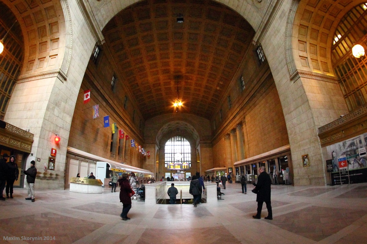 In the Great Hall of Toronto's Union Station on Family Day 2014, we see lots of people and families rushing off or on their trains to begin or end their journey via rail.