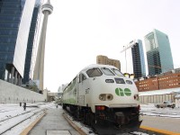 GO Tranit's brand new livery paint scheme....Here we see GO 607, one of the engines painted in the new scheme, arriving on a Eastbound GO Train bound for Oshawa, ON, with Canada's "CN Tower" in the background along with a few skyscrapers.