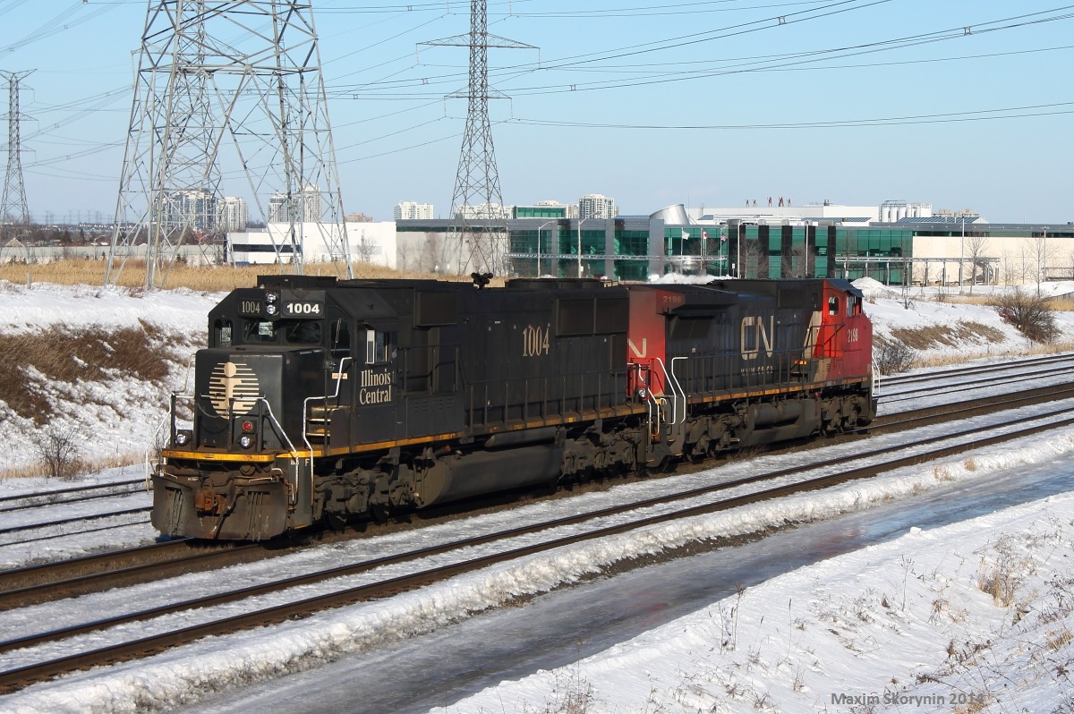 A powermove consisting of a CN GE, and IC SD70 still showing its black IC color, passes Snider heading to go rescue a stalled 302 at Langstaff on the Canadian National Bala subdivision, pulling it back to Mac yard with the IC leading. Unfortunately, I did not stay as long to see it and will not have any photos.