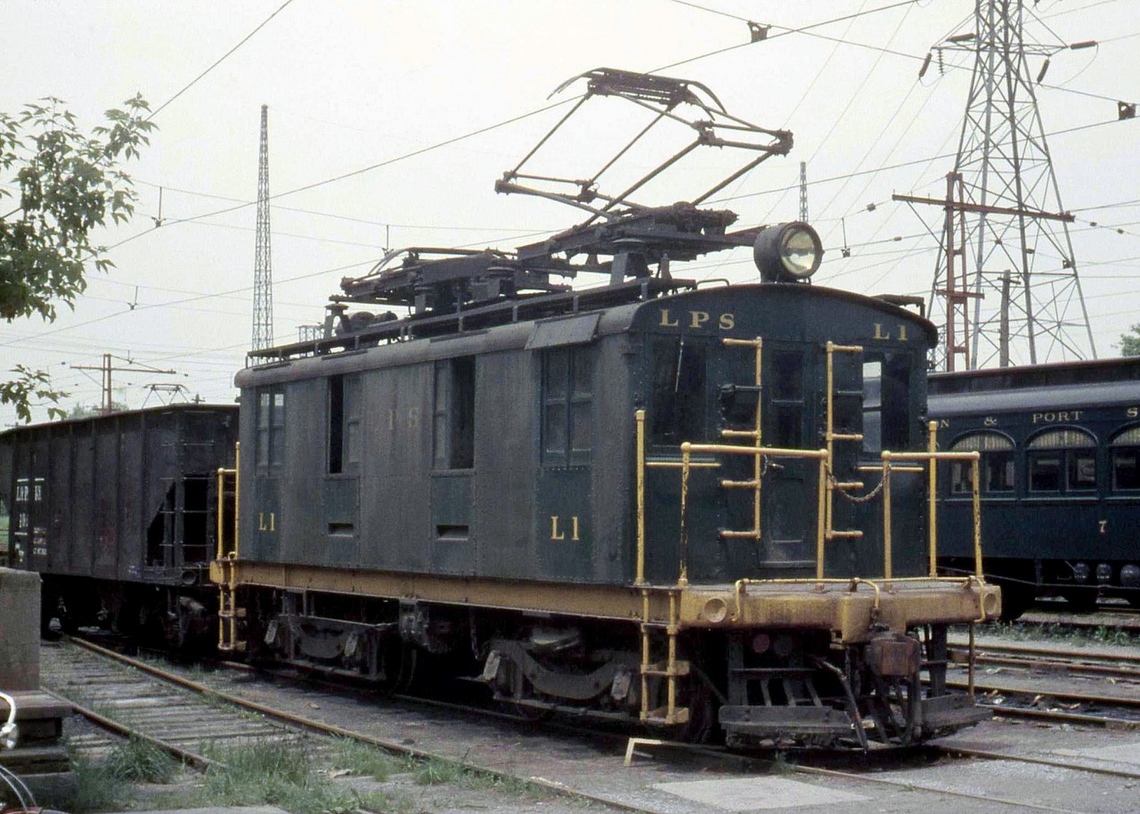 London and Port Stanley Railway boxcab locomotive L1, another of three boxcabs electrics built by GE in 1915 (L1, L2 & L3), switches a hopper downtown in London ON in 1959. For sister L2, click here.
[Editor's note: L1 now resides at the Elgin County Ry Museum in St. Thomas, as seen here. For an earlier photo of L1 taken by Julian Bernard in 1954, click here.]