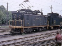 One of London and Port Stanley Railway's 60-ton GE boxcab electric units, L2, switches their London Yard in 1959. Coupled behind it is flanger car FA1.
<br><br>
<i>[Editor's note, L2, built in 1915, survives today at the Halton County Radial Railway museum]</i>
