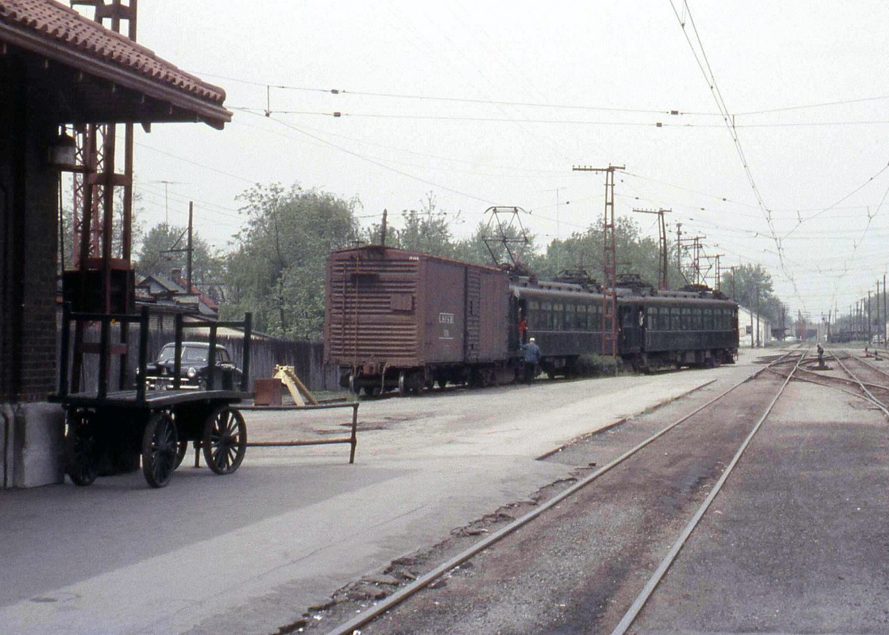 In 1957 I was on an LP&S excursion out of London, two of their interurban electric passenger cars (10 and 8) were used. On the way we took a box car (to help pay the "rent"). The two cars are seen here switching the boxcar by the LP&S station in St. Thomas, ON.

[Editor's note: both cars 8 and 10 (built 1915 and 1914 resp. by Jewett) are preserved today, with 8 residing at the Halton County Radial Railway in operating condition, and 10 at the Canadian Railway Museum/Exporail in St. Constant QC. Info from the Canadian Trackside Guide]