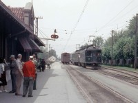London and Port Stanley Railway electric interurban cars 10 and 8 switch their boxcar at St. Thomas ON, while excursion riders from the train look on from the L&PS St. Thomas Station platform. While the L&PS operated freight service with dedicated electric motors (like boxcab electric locomotive L2 <a href=http://www.railpictures.ca/?attachment_id=13450><b>here</b></a>), often times a passenger train took on freight loads to help "pay the rent".