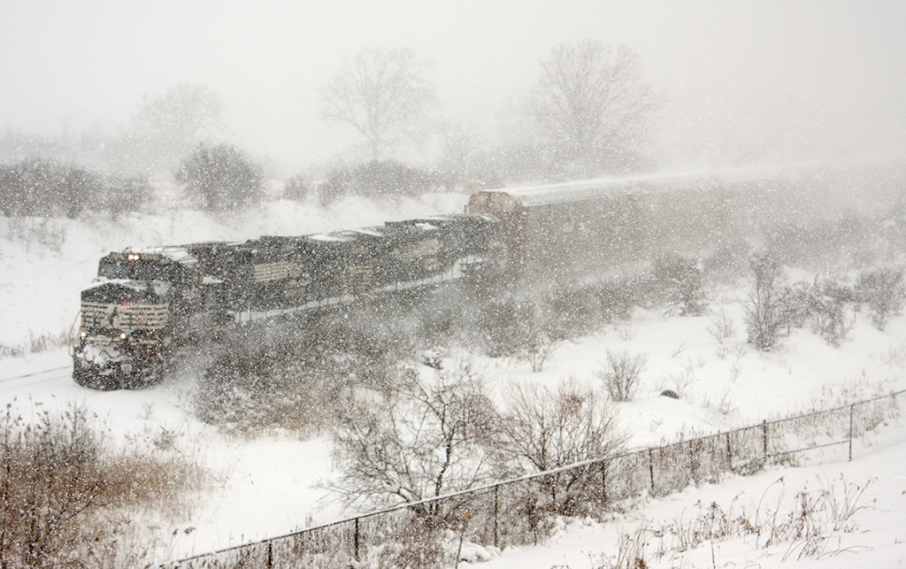 Braving the elements of the storm thats hitting the Greater Toronto Area, I head to the Halton Sub mile 5.5 other wise known as "Knuckle Alley" for a few hours. Here we have CN 393 with NS 9587, NS 9582. I will say it was all worth it for the 3 trains I was able to shoot in the winter blizzard.