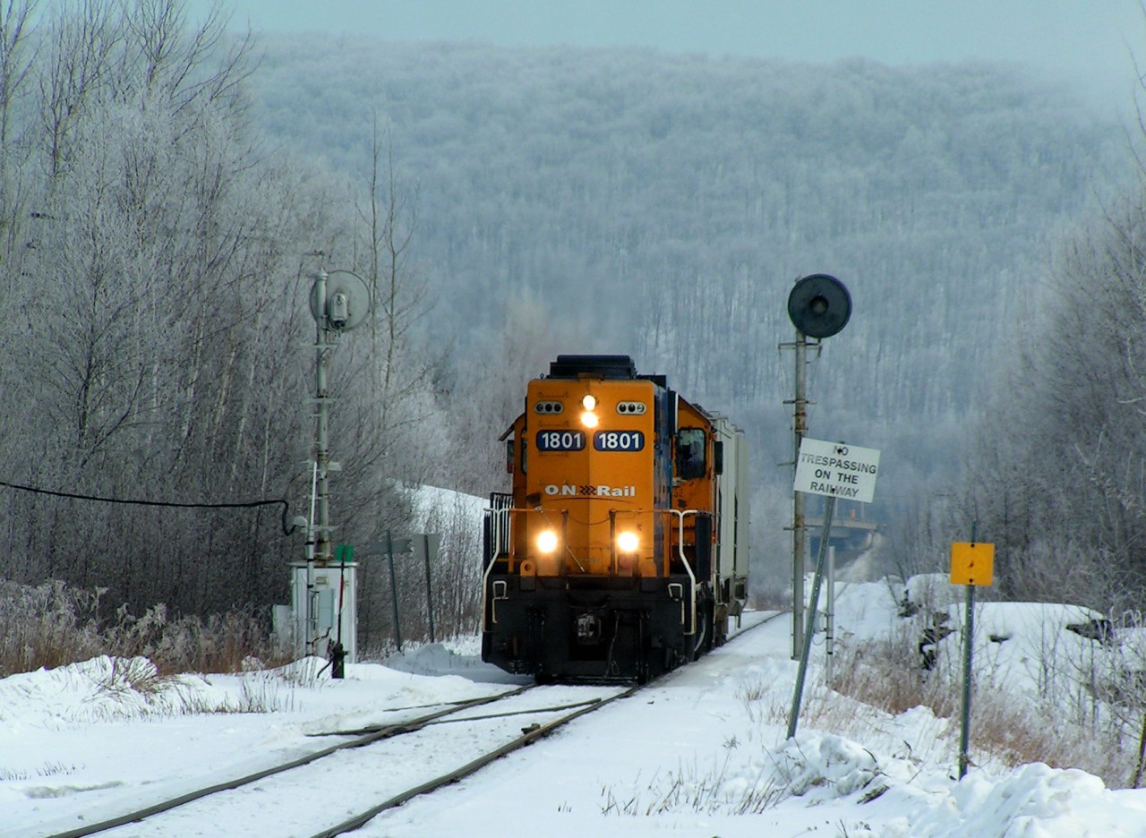 ONR GP 38-2 #1801 finishes switching at Arclin on a frosty morning and heads back to the ONR yard with 2 hoppers in tow. 02/20/2014