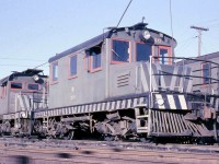 More of Oshawa Railway's electric locomotives, or "motors" as many railways called them, at the OR's shops off Hillcroft St. Here we have motor 326 coupled to 402, both of slightly different designs. Note the pole hung between 326's trucks, used to for moving or "poling" cars on adjacent tracks by way of the round holes or poling pockets on the pilot end. A somewhat dangerous practice that many railroads abandoned.