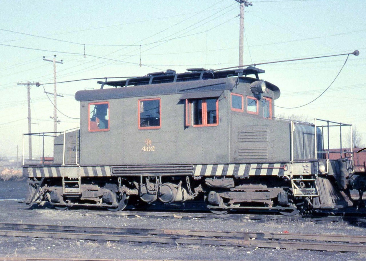 The Oshawa Railway was a small electric regional railway that provided passenger and freight service in the City of Oshawa from the late 1800's until owner CN converted operations from electric to diesel in May of 1964. Pictured here at Oshawa Railway's shops is OR 402, an electric freight motor built new by OR in 1928, retired in 1964, and scrapped by CN in 1969.

 [Note: image geotagged for OR's "new" shops, which were located just south of Rossland Rd. East]